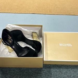 Michael Kors Platform black and gold heels.